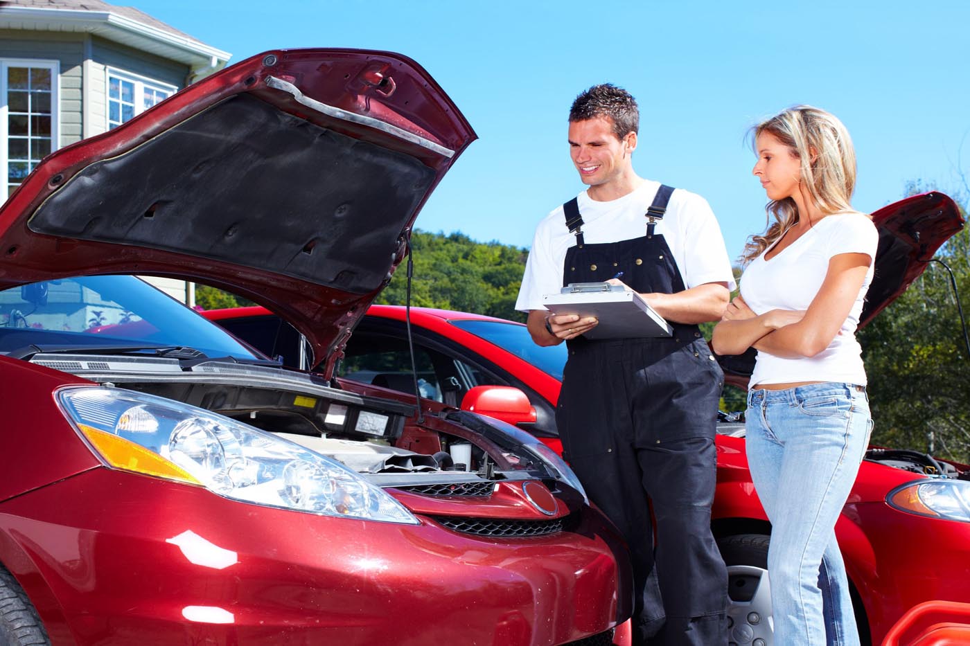 CTL mechanic inspecting a vehicle with the client